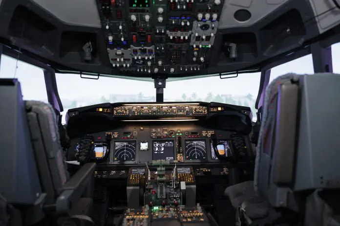 Nobody in empty airplane cockpit with dashboard command Voar seguro