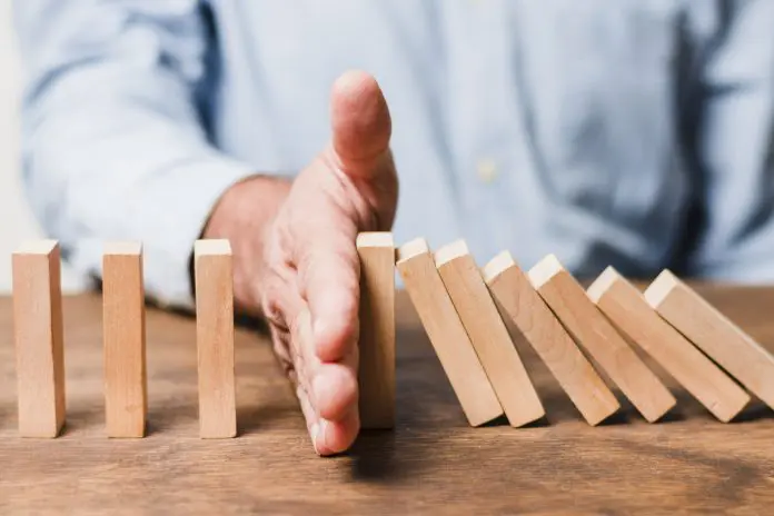 businessman-using-wooden-pieces