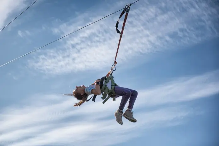 Child laughs and screams while she zip lines Meliá Punta Cana