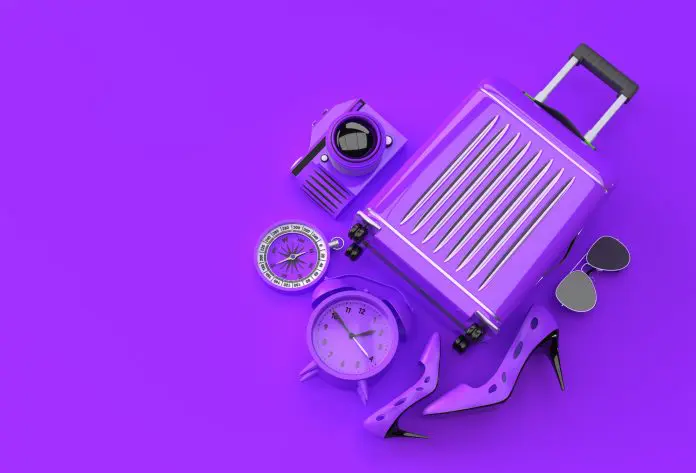 3D Render Suitcase with Traveler Accessories on Purple Backgroun Hero Black Friday