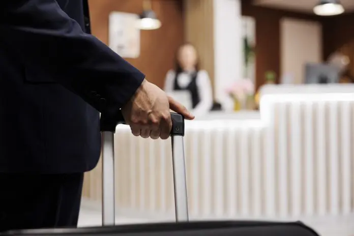 Businessman arriving in hotel lobby